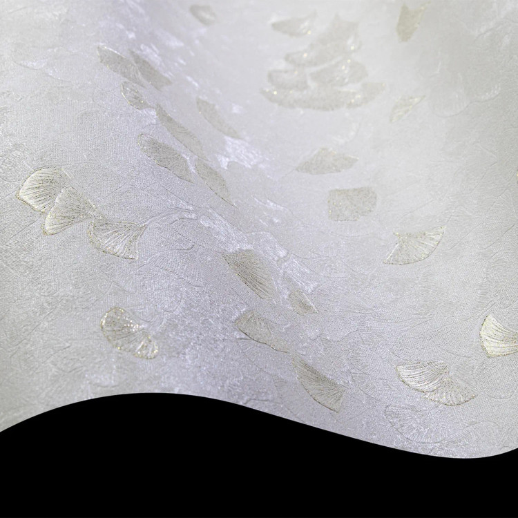 نمای نزدیک از کاغذدیواری طرح گل بادبزنی با دانههای اکلیلی در دو رنگ صورتی ملایم و طلایی مجلل